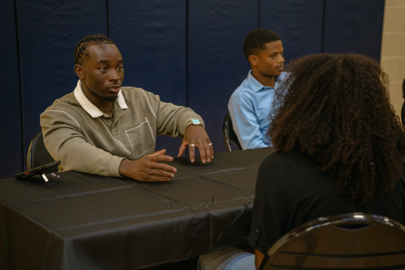 A one-on-one coaching conversation at First Aid Palooza