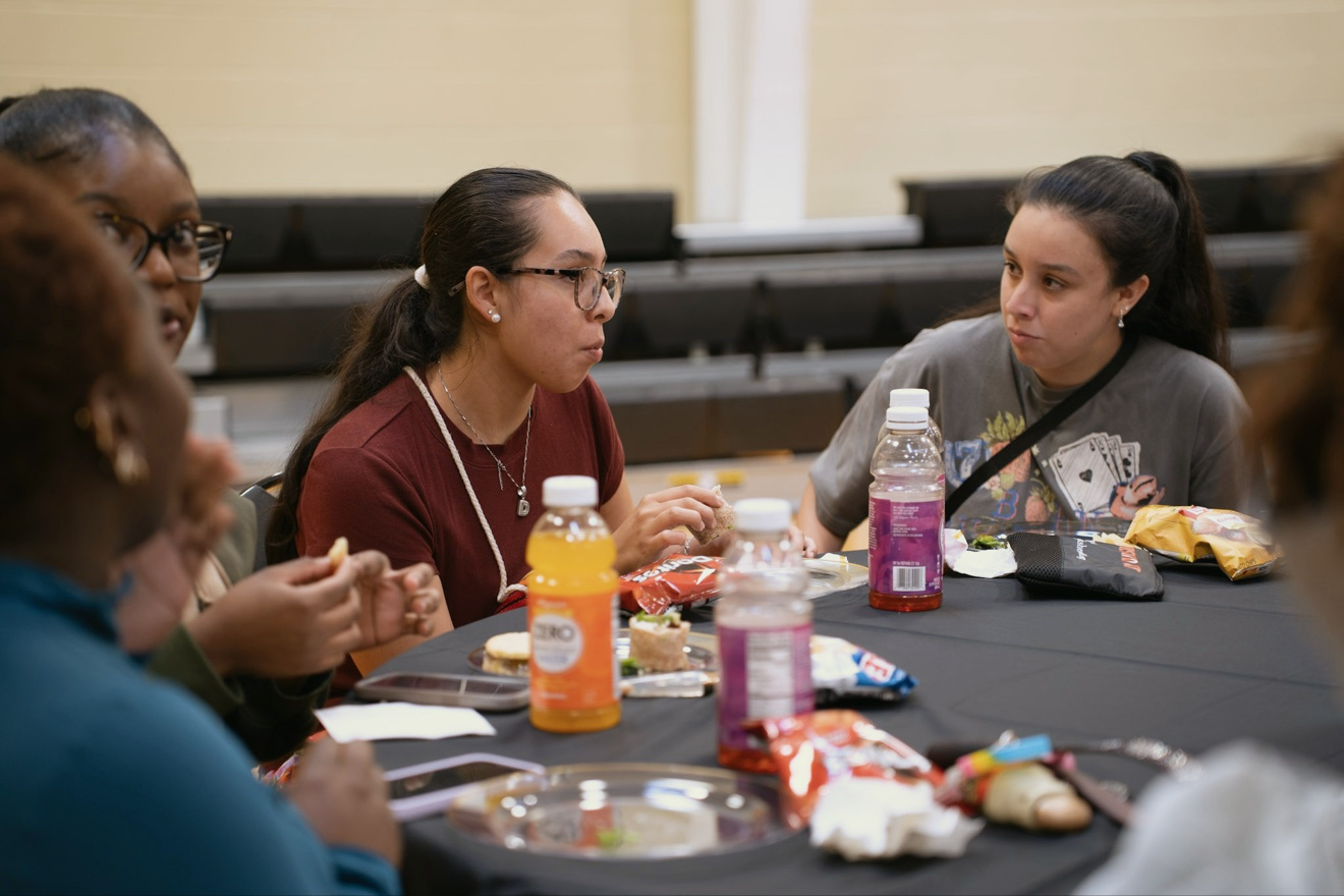 Community members share a meal together at First Aid Palooza
