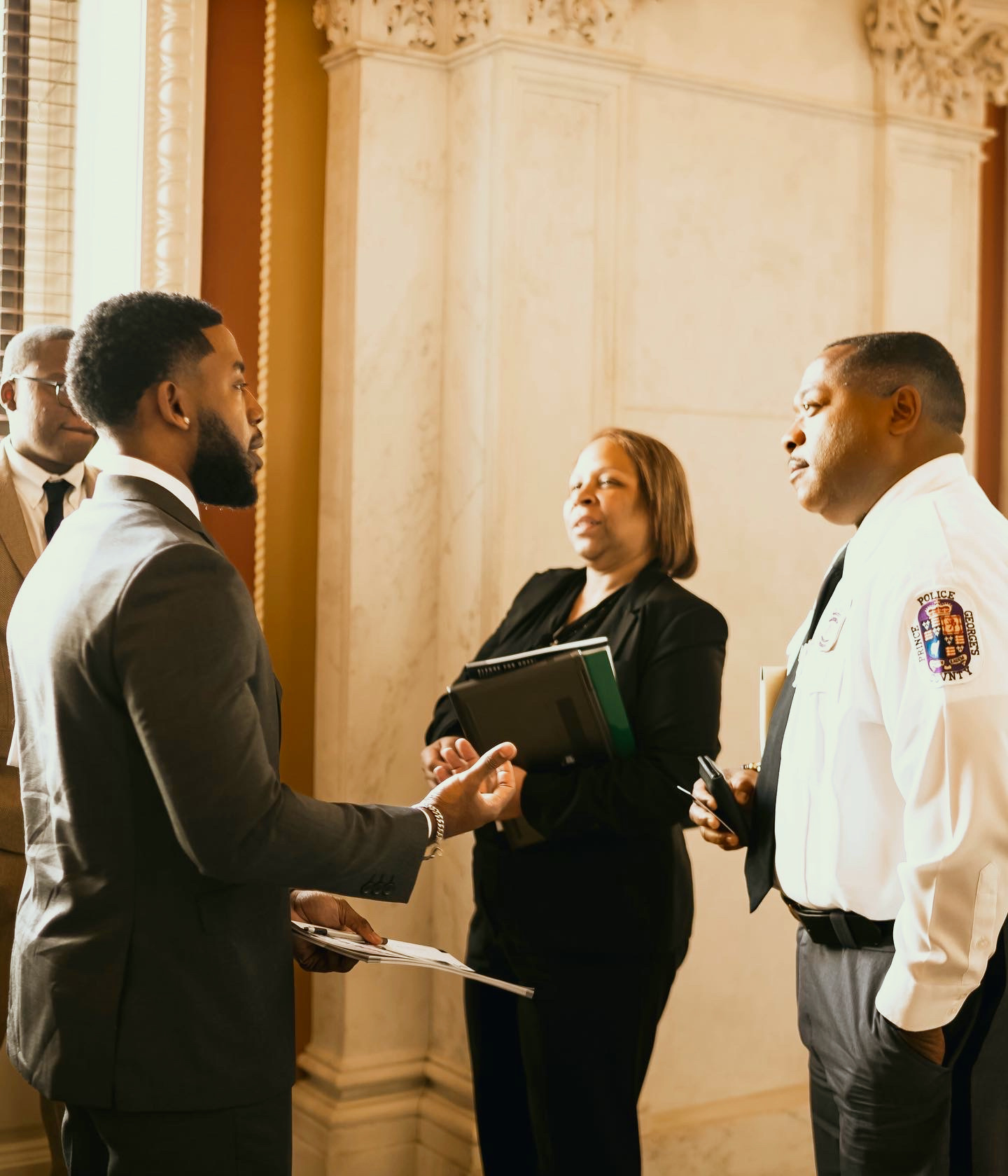 GoodWorks founder speaking with a Prince George's County police officer