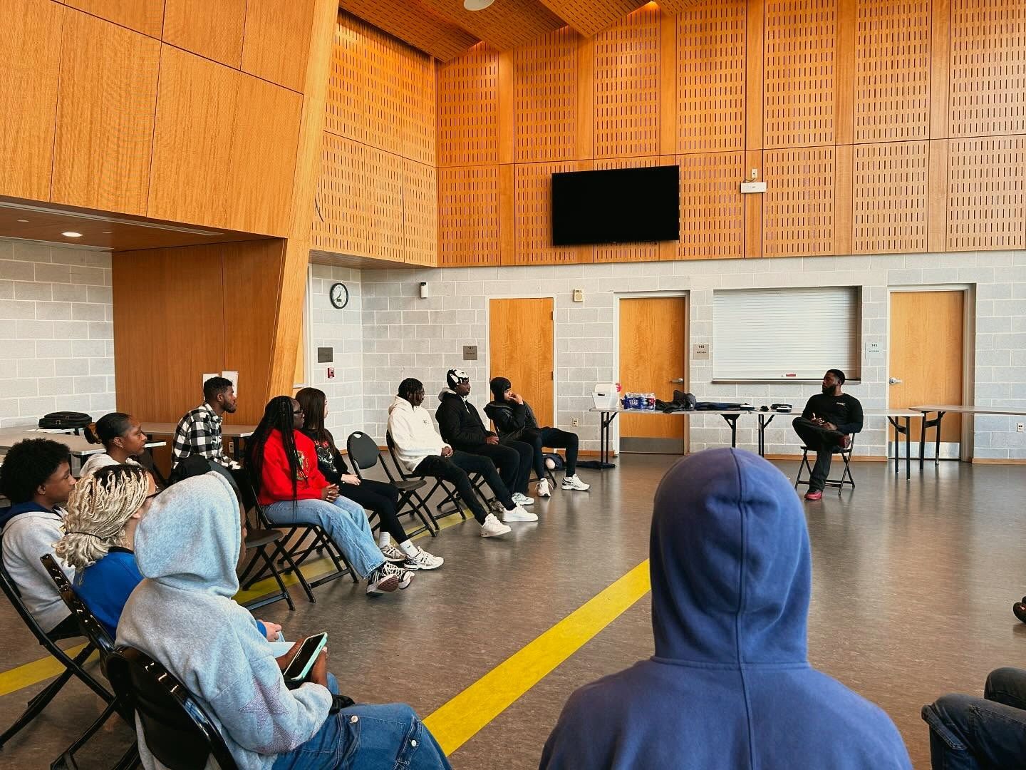 Community members seated in a circle during a GoodWorks lifesaving class