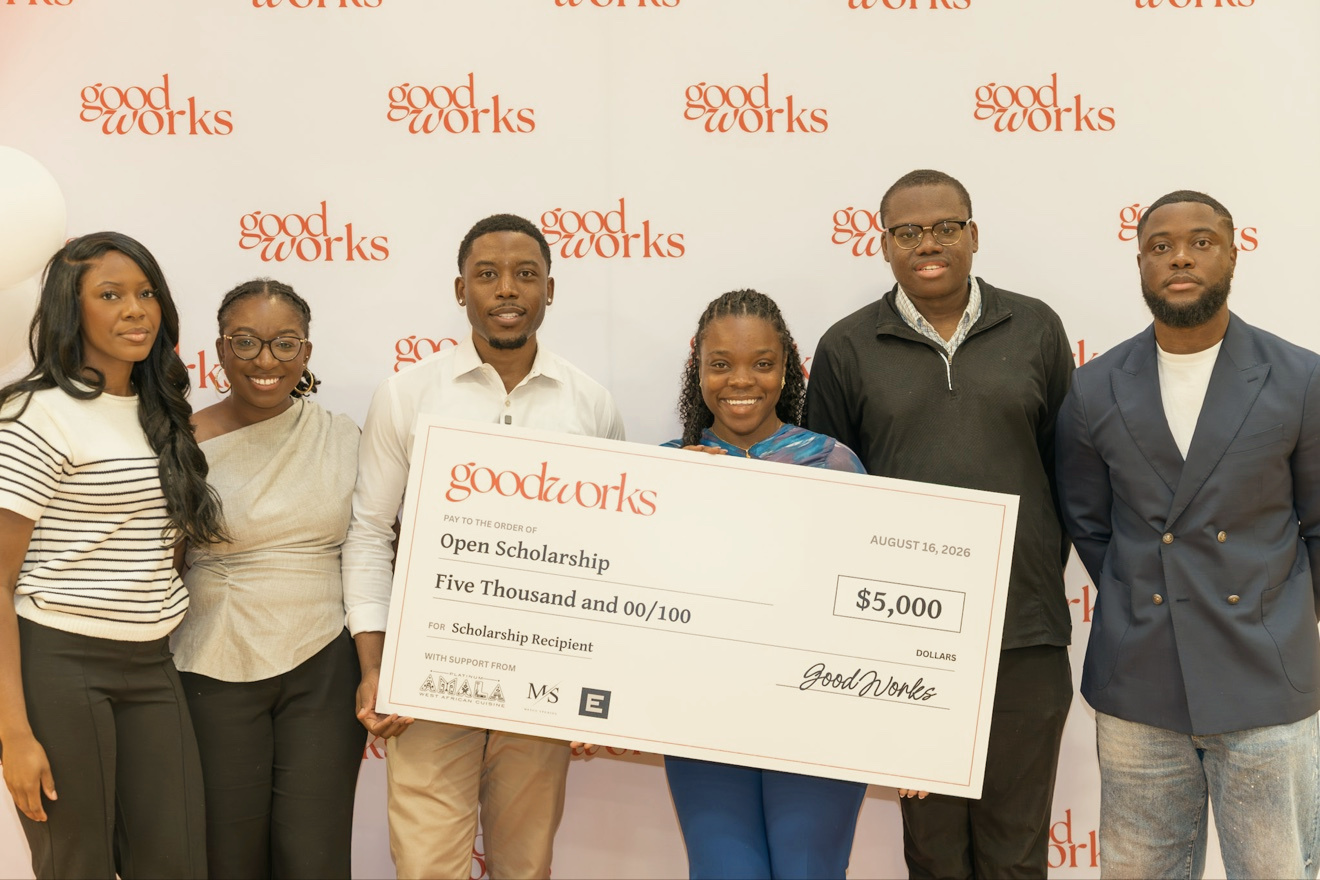A $5,000 Open Scholarship check is presented at First Aid Palooza
