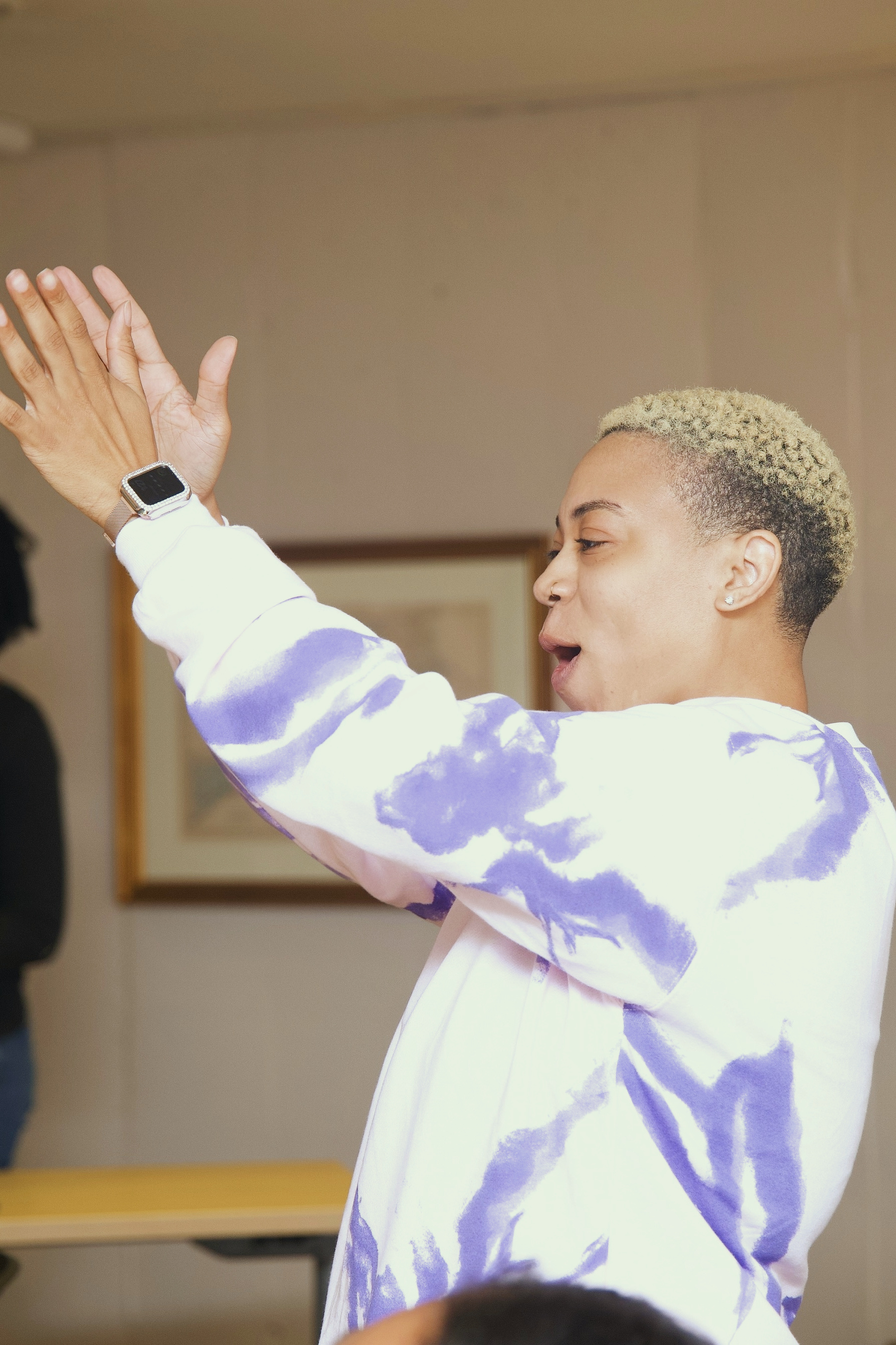 A participant raises his hand during a GoodWorks training
