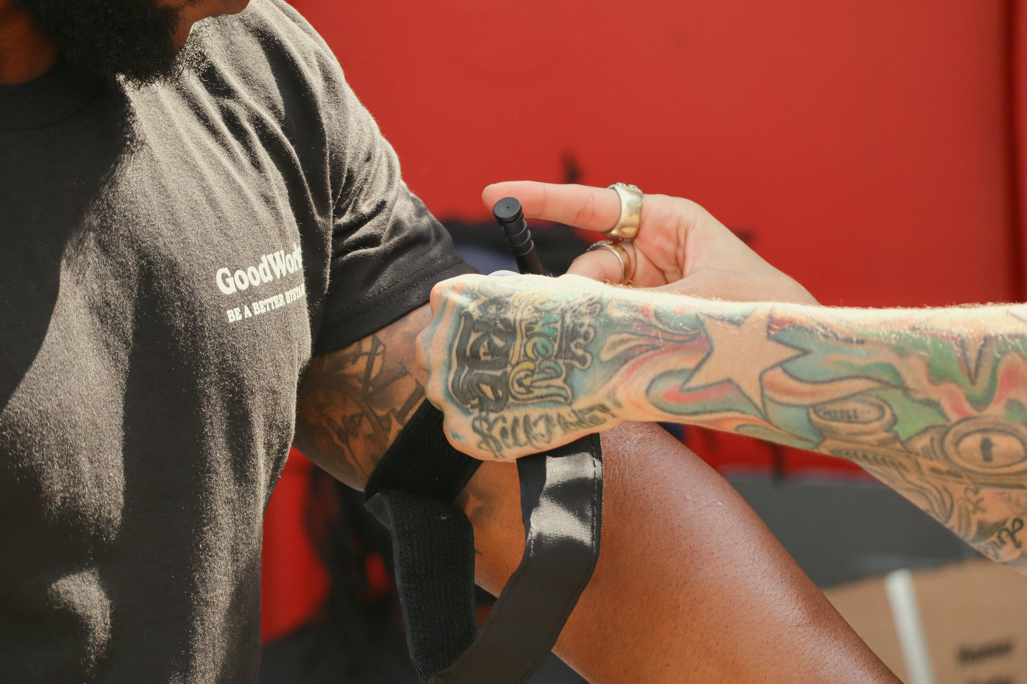 A festivalgoer practices applying a tourniquet during a GoodWorks demonstration